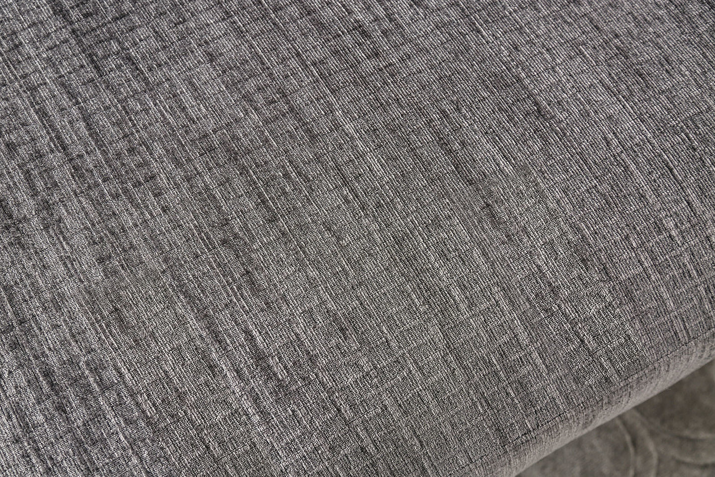 Closeup of grey linen fabric texture with a subtle woven pattern for upholstery
