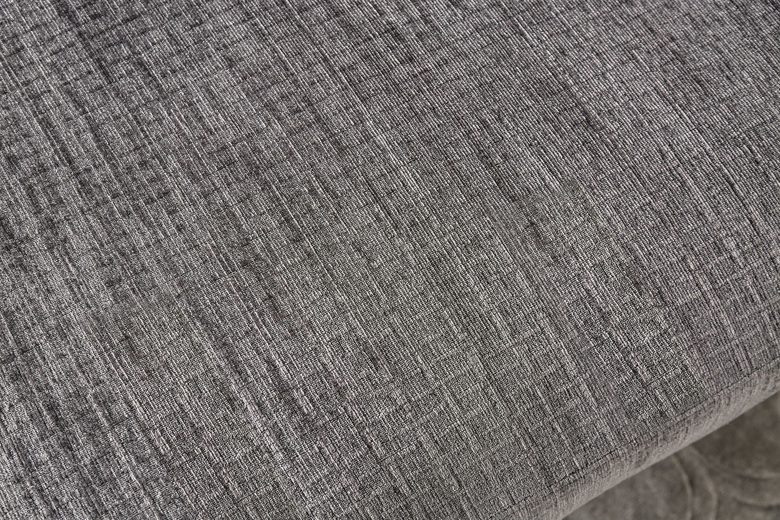 Closeup of grey linen fabric texture with a subtle woven pattern for upholstery