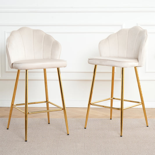 Two cream velvet scallop back bar stools with gold legs