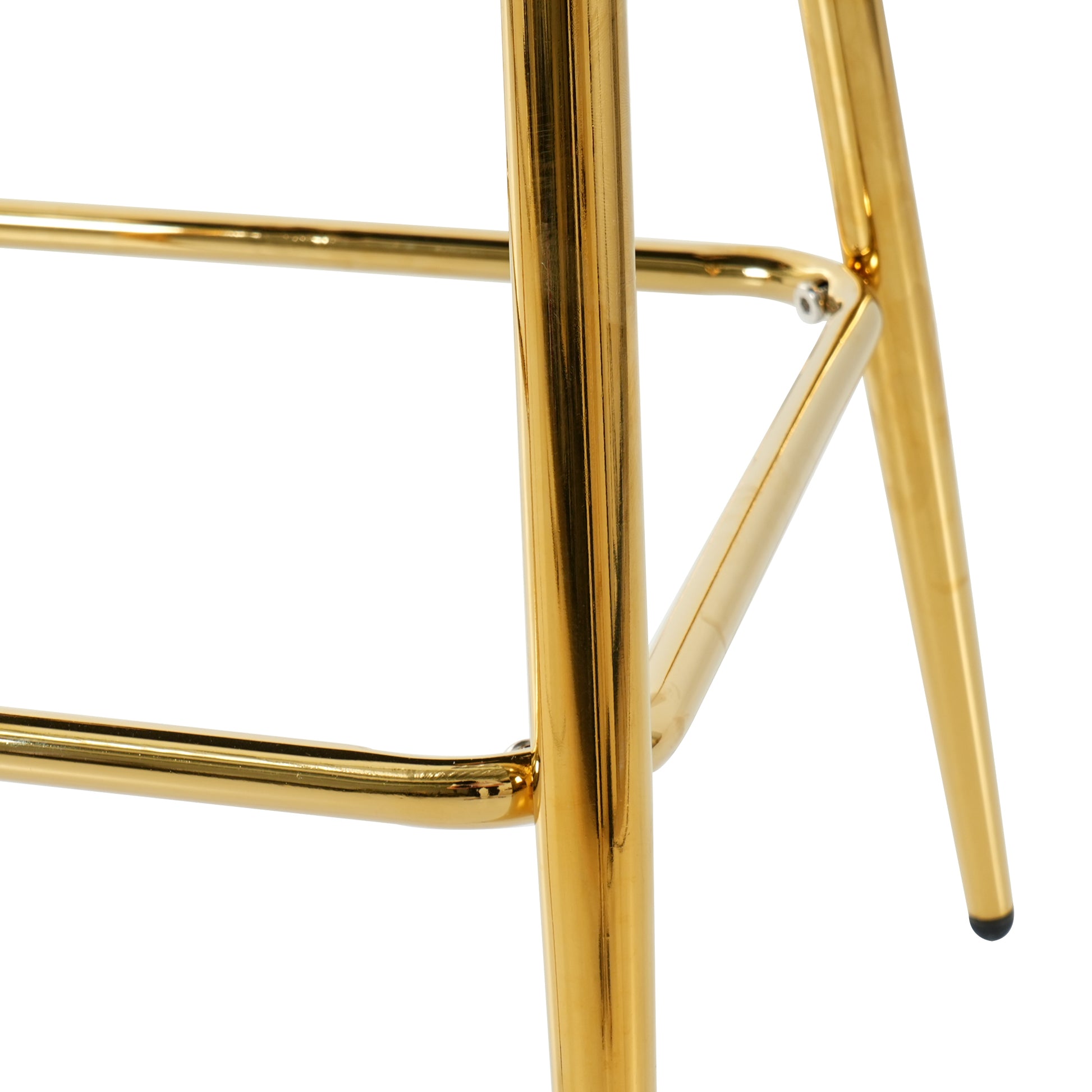 Close up of a polished gold metal bar stool frame with clean lines
