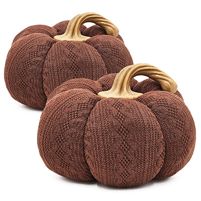Two brown knitted decorative pumpkins with twisted beige stems