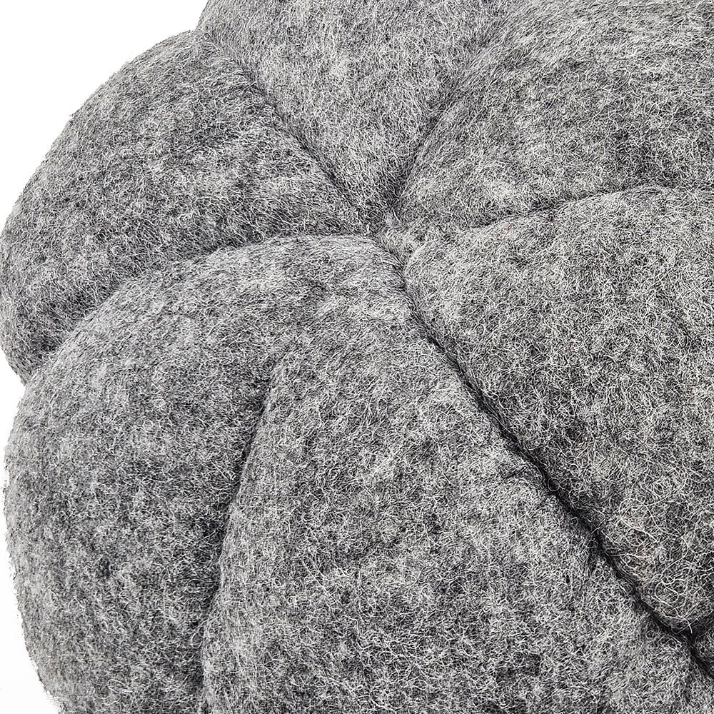 Textured grey felt pouf with quilted stitching detail for a modern living room