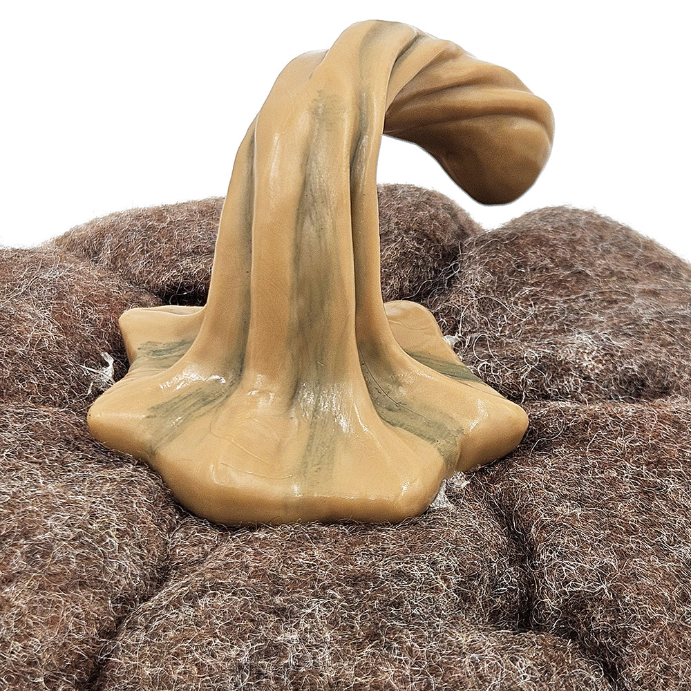 Close up of realistic brown textured pumpkin with tan twisted stem fall decor detail