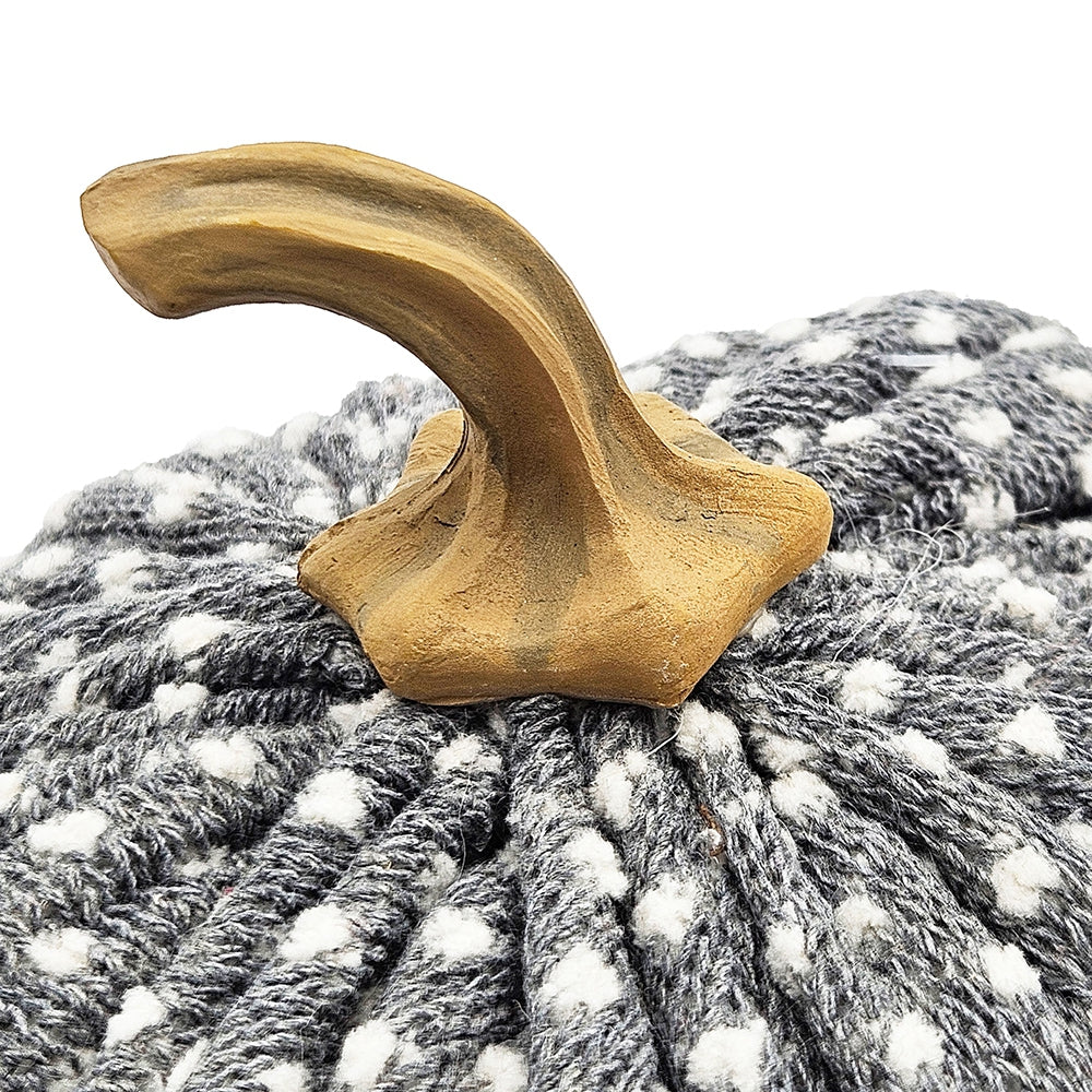 Textured fabric pumpkin with dotted pattern and realistic wooden stem ideal for fall decor