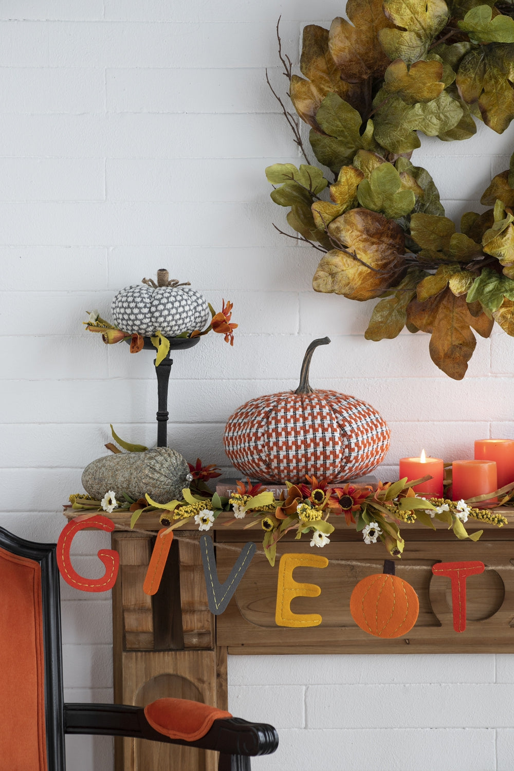 Decorative fabric pumpkin with a white and grey geometric pattern and jute stem