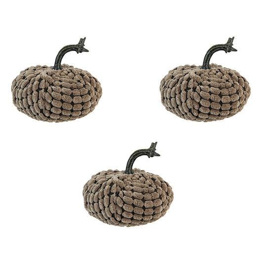 Three plush brown pumpkins with dark brown textured stems arranged on a white background