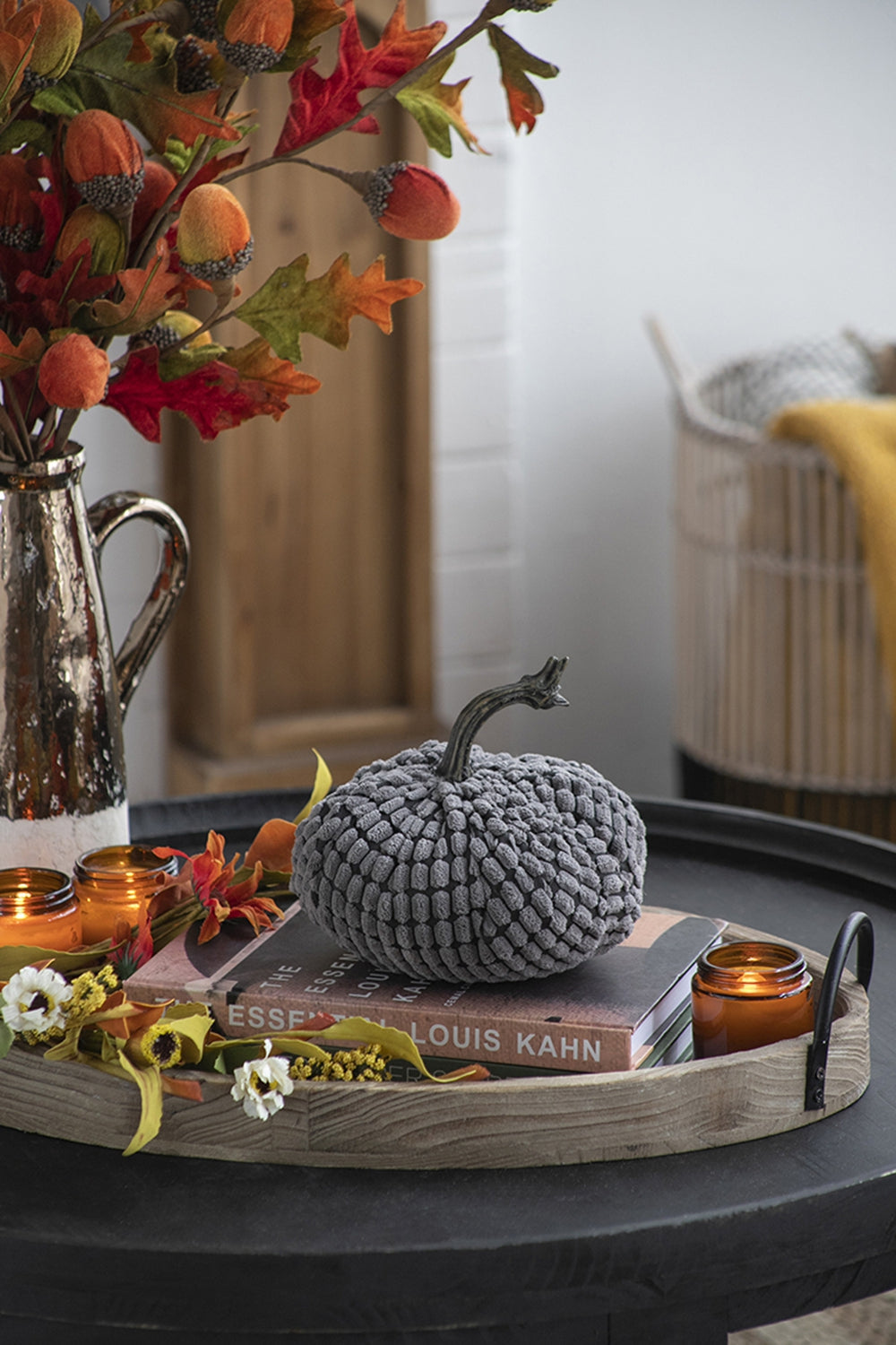 Textured gray fabric pumpkin with a realistic stem a cozy autumnal decor