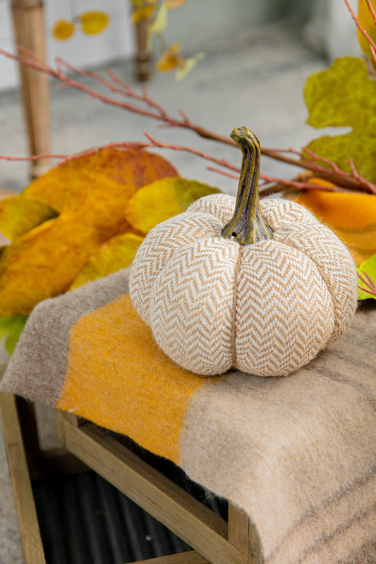 Textured fabric pumpkin with herringbone pattern in beige and white ideal for fall decor