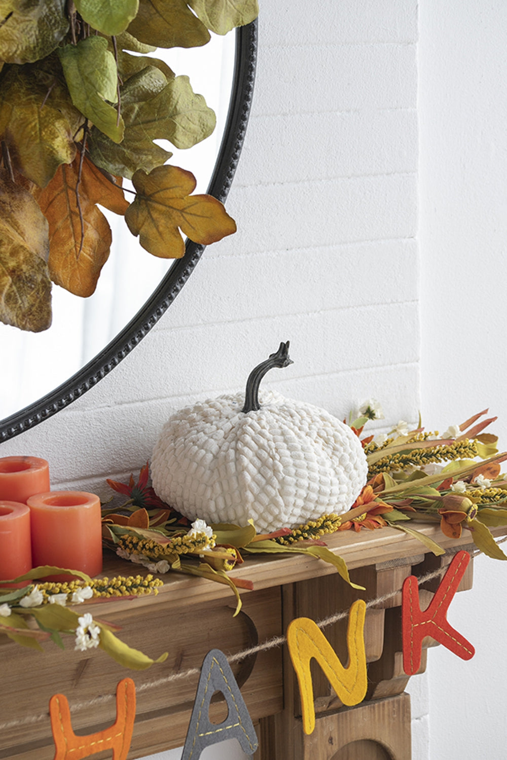 Textured white fabric pumpkin with a dark stem ideal for fall decor