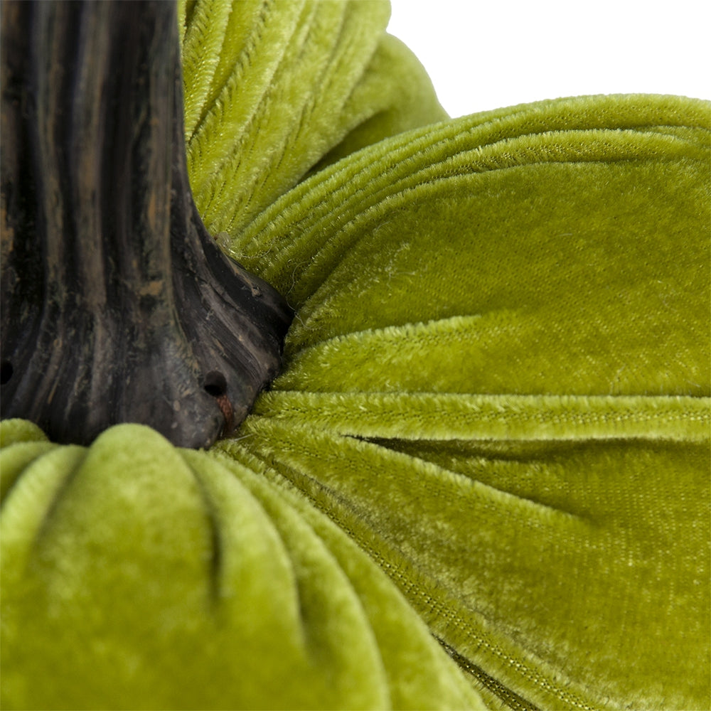 Closeup of a plush velvet pumpkin in lime green with a textured dark stem for fall decor