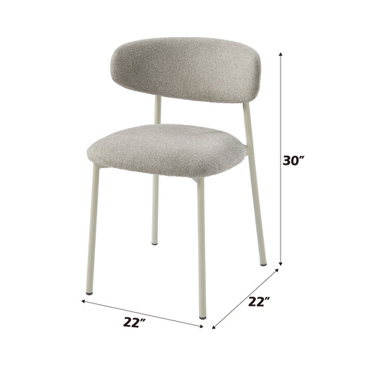 Modern boucle fabric chair with a rounded back and slender ivory metal legs perfect for dining rooms