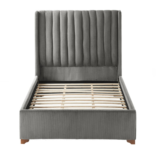 Grey upholstered bed frame with vertical channel tufting and wooden slats