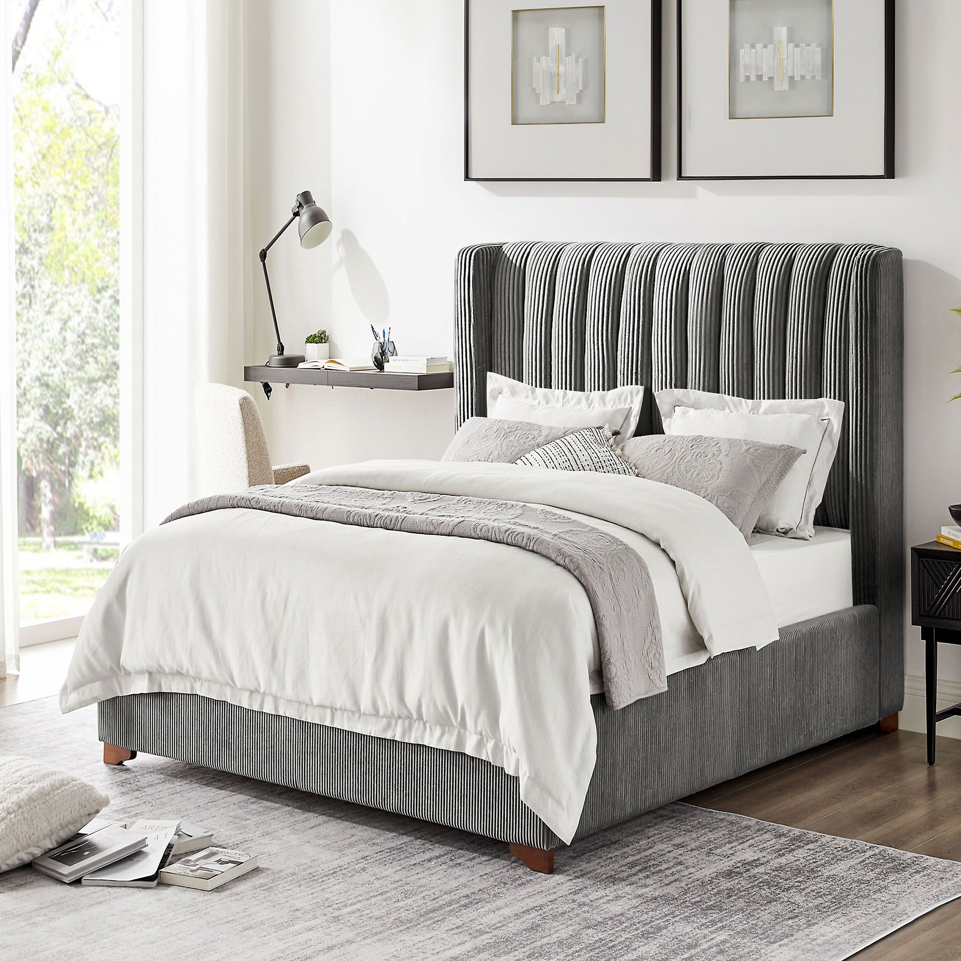 Upholstered king bed frame with vertical grey tufting on the headboard and striped base