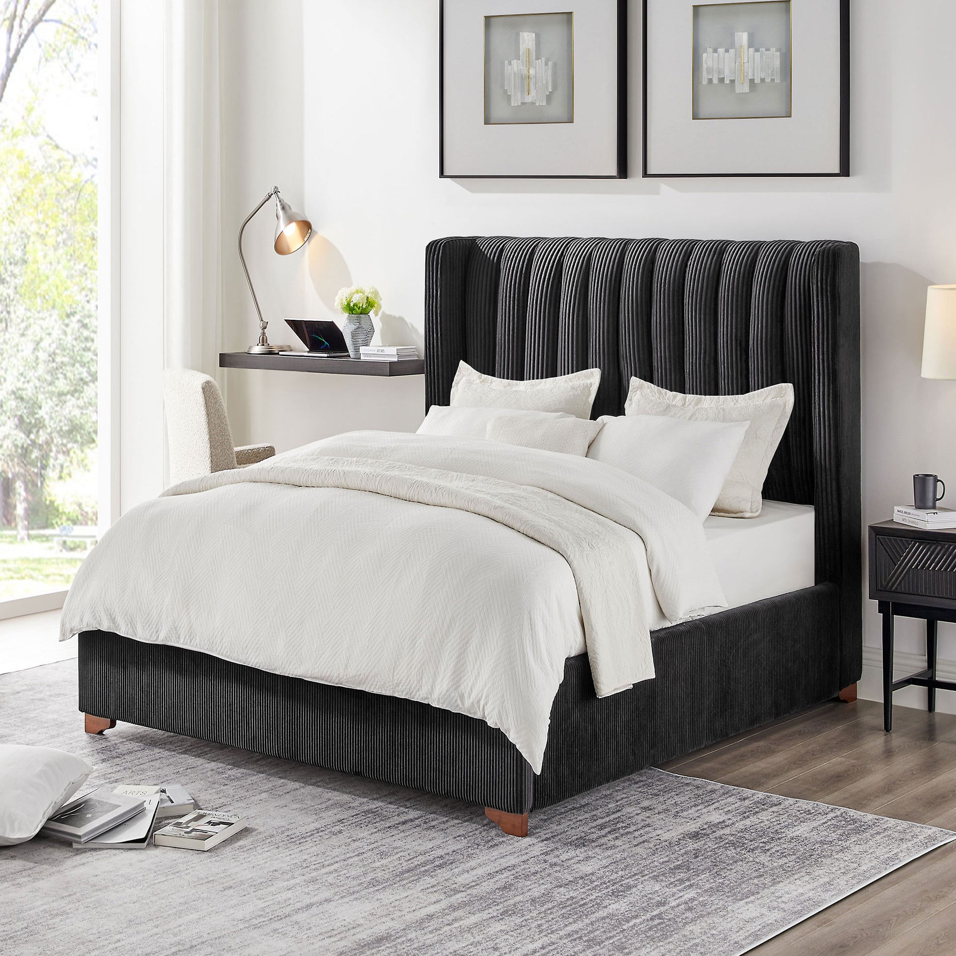 Black velvet king bed with vertical channel tufting white bedding and wood legs