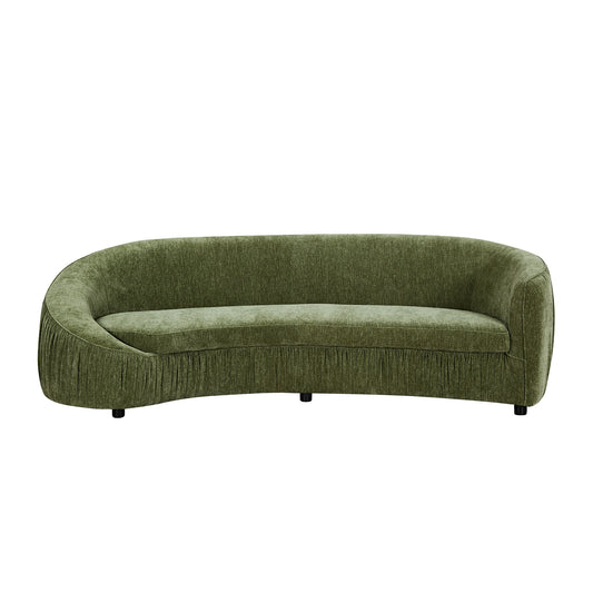 Curved green fabric sofa with pleated skirt detail