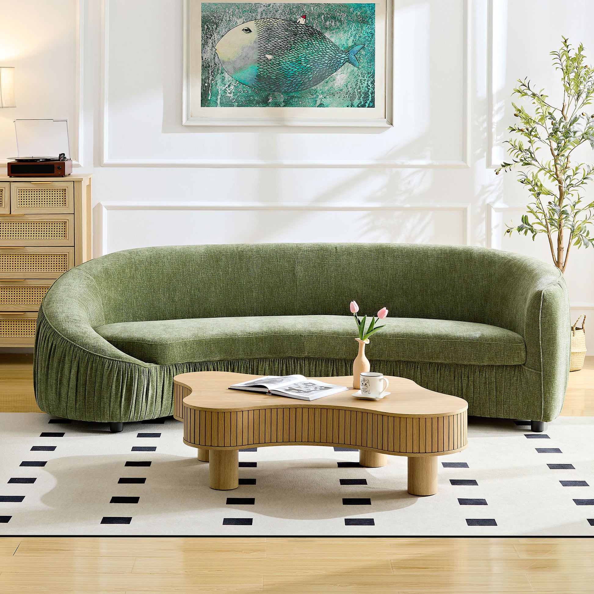 Curved emerald green fabric sofa with pleated skirt detail modern living room furniture