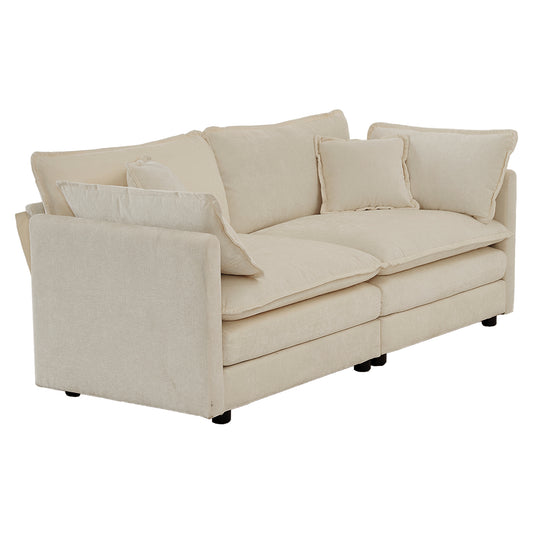 Plush cream fabric sectional sofa with deep seating and matching throw pillows perfect for modern living rooms