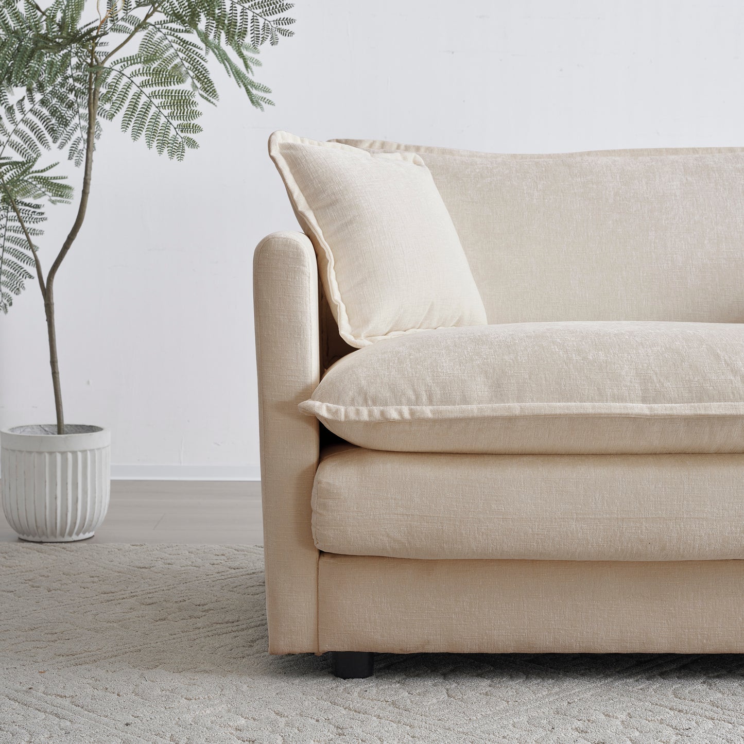Comfortable neutral fabric sofa with plush cushions perfect for living room seating