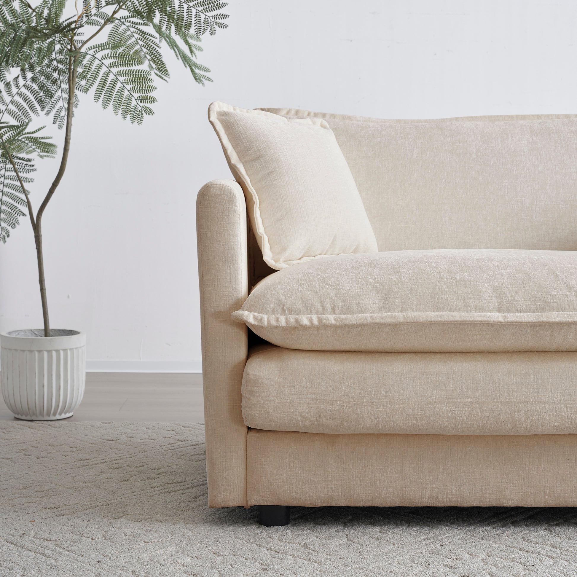 Comfortable neutral fabric sofa with plush cushions perfect for living room seating