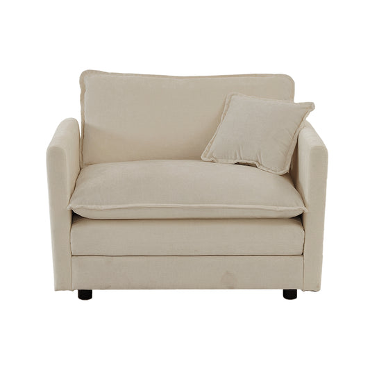 Cream upholstered accent chair with plush cushions and a throw pillow