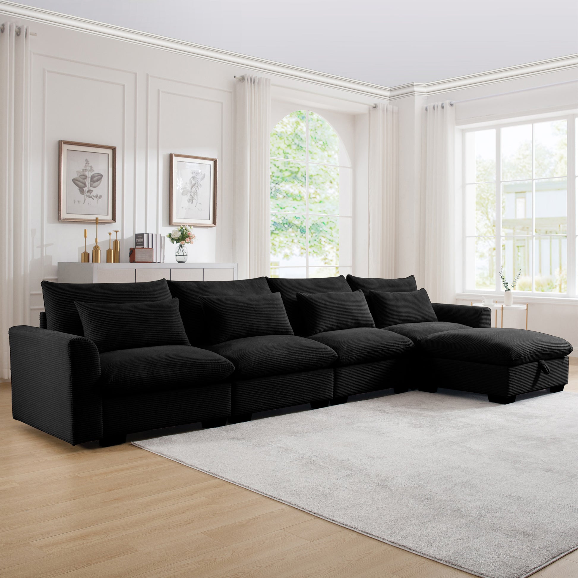 Black corduroy sectional sofa with plush cushions and chaise lounge