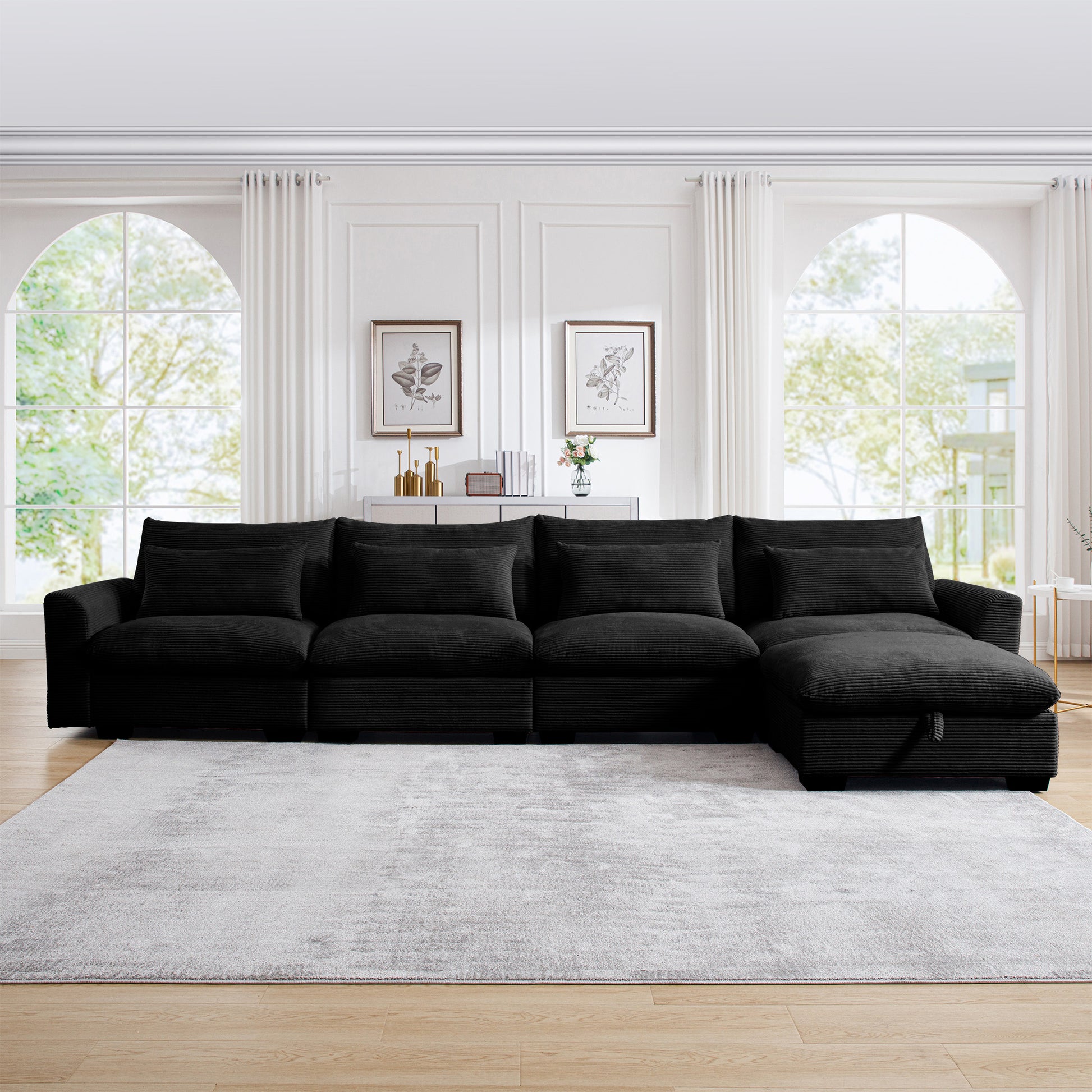 Black corduroy sectional sofa with plush cushions and chaise lounge