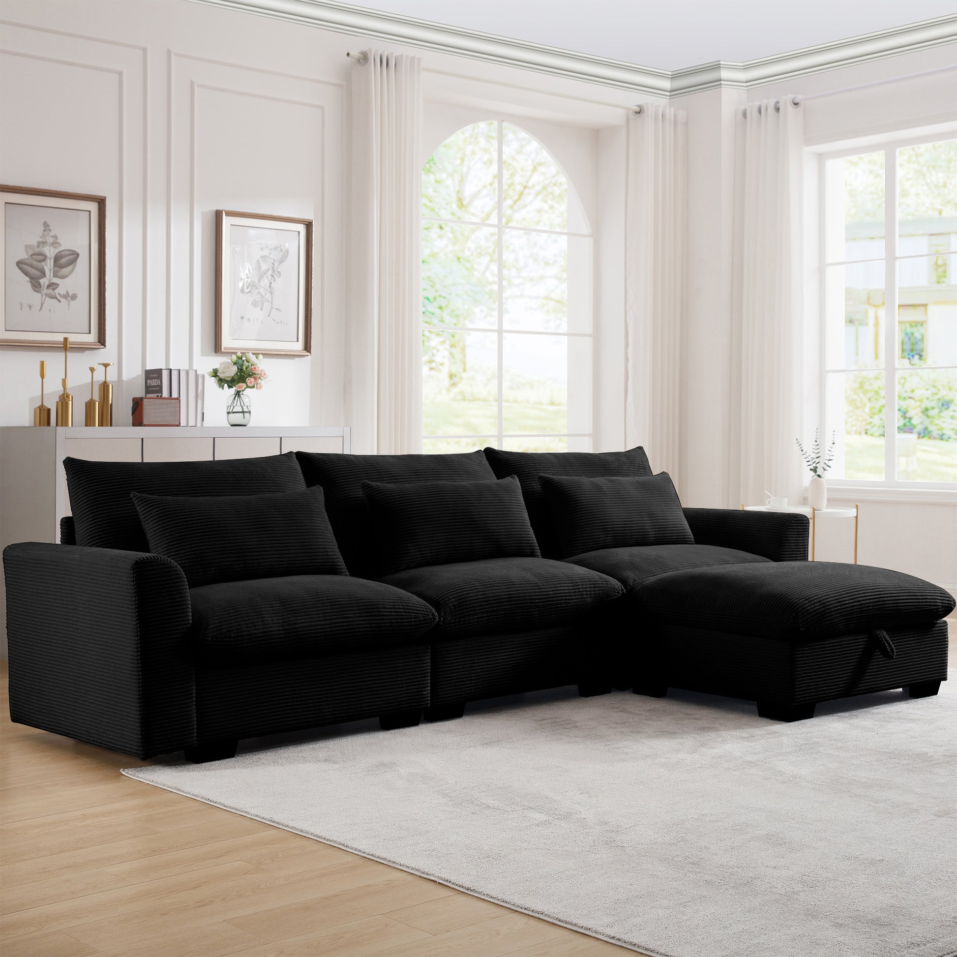 Black corduroy sectional sofa with plush cushions and chaise lounge