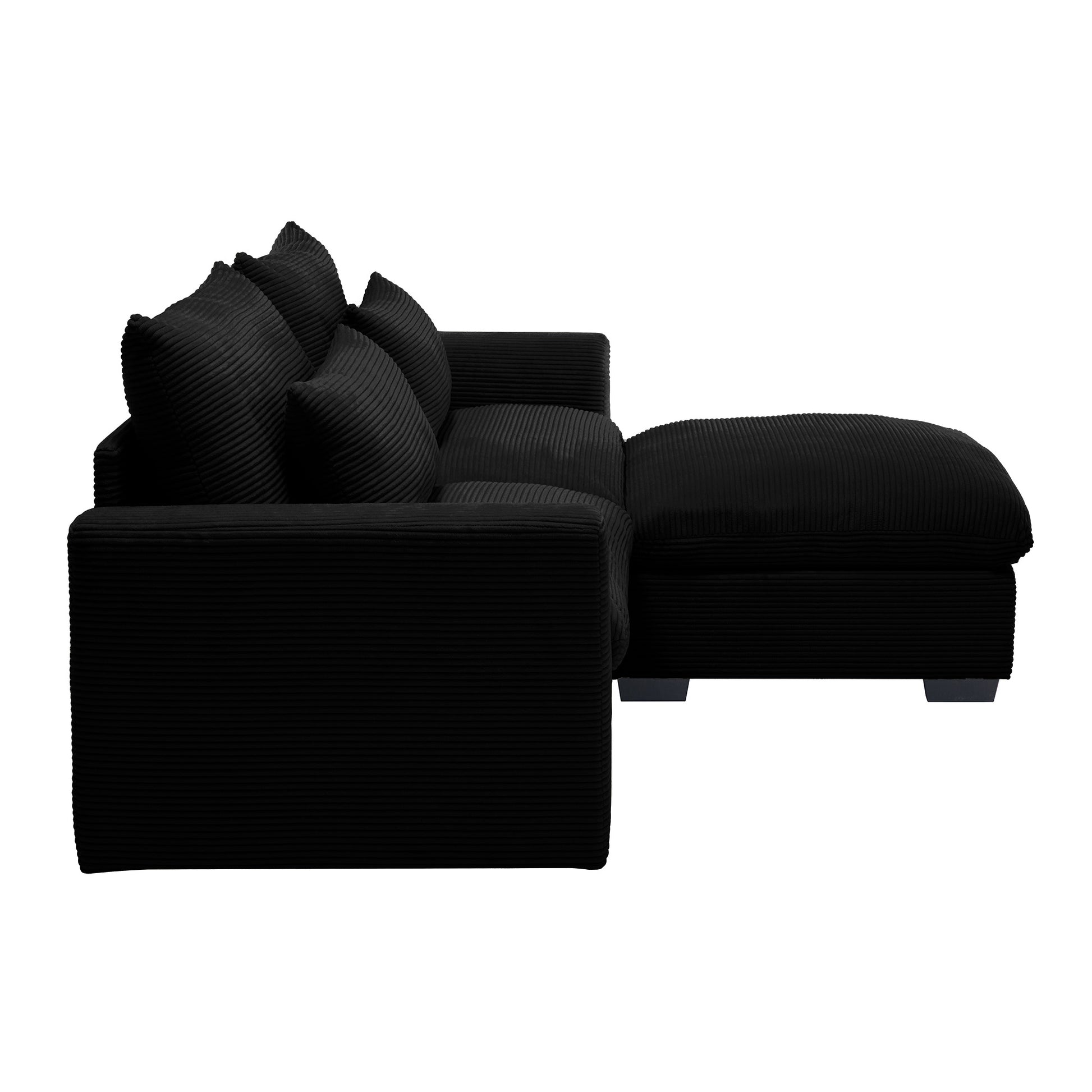 Black corduroy sectional sofa with plush cushions and chaise lounge