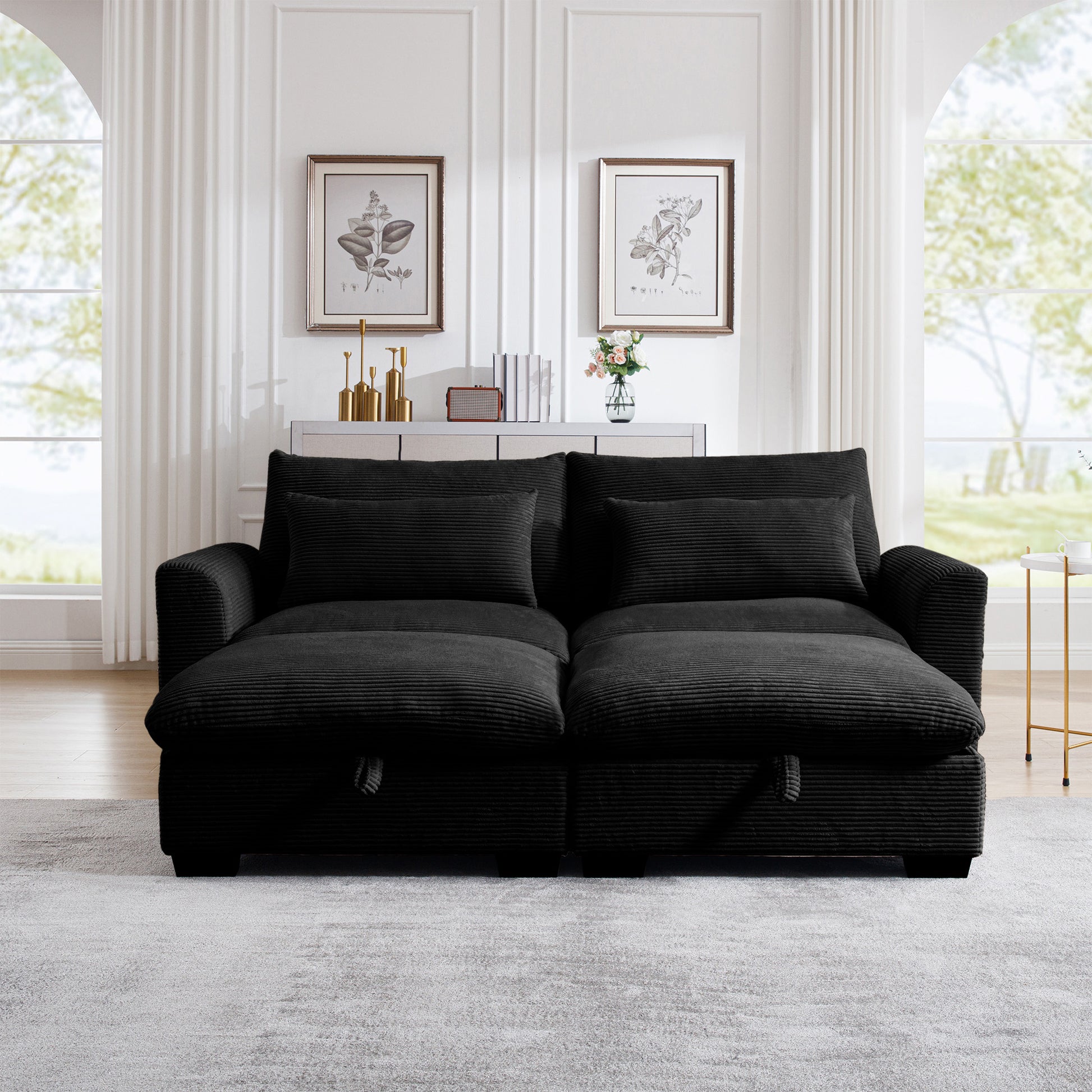 Plush black corduroy sofa with two matching throw pillows perfect for living rooms