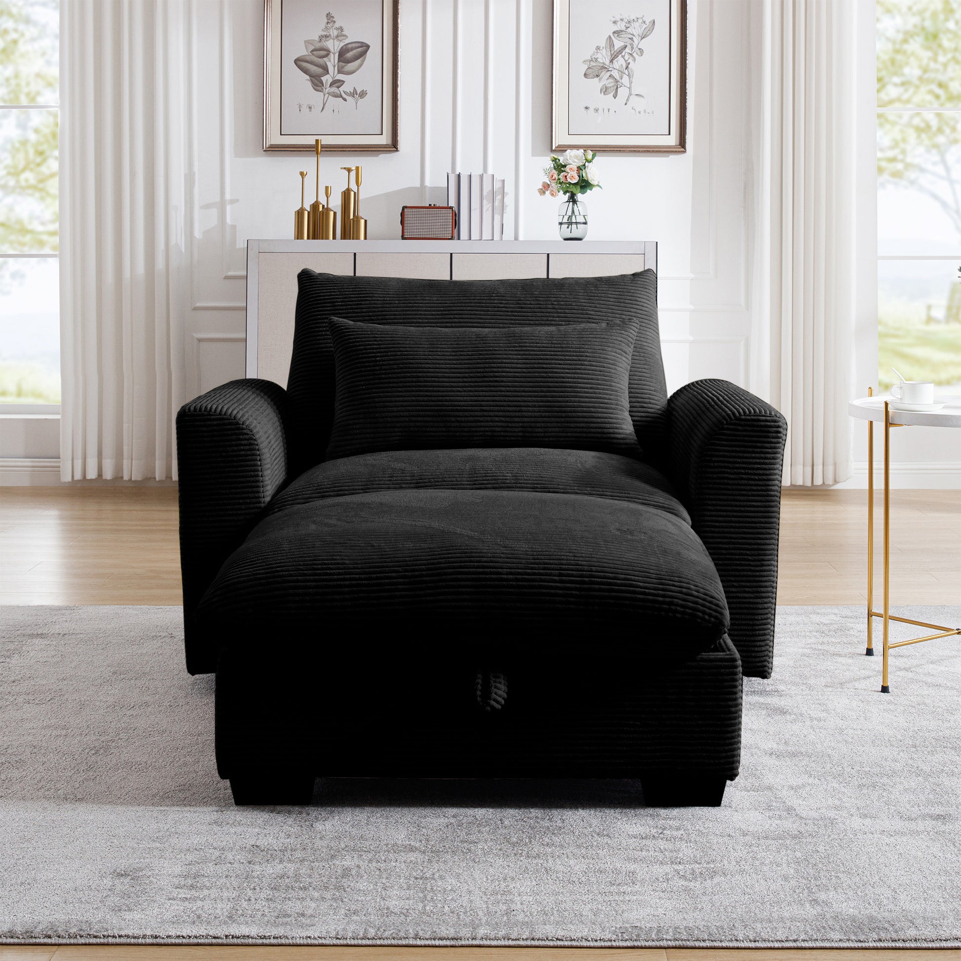 Black corduroy convertible chair with pullout ottoman and matching pillow