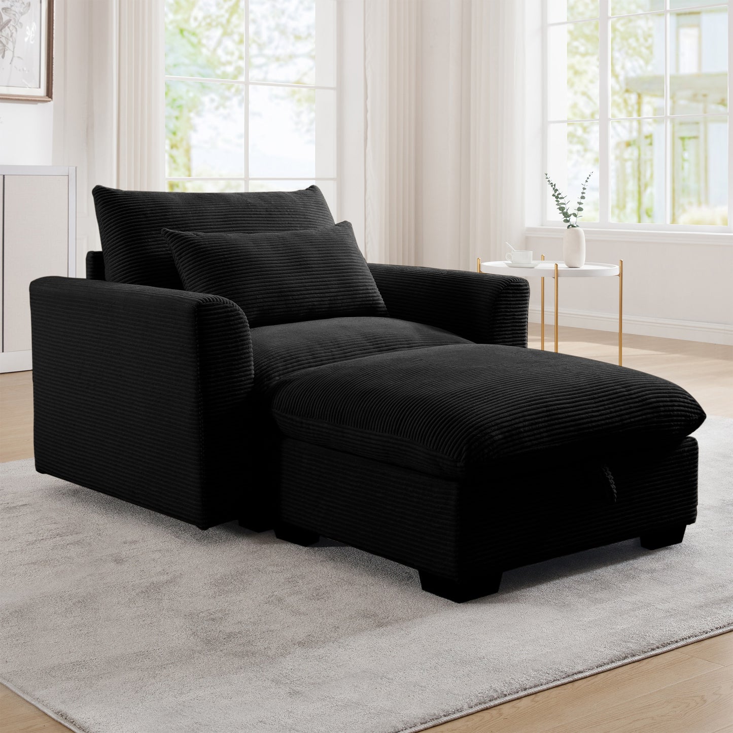 Black corduroy chaise lounge chair with plush cushions and storage ottoman