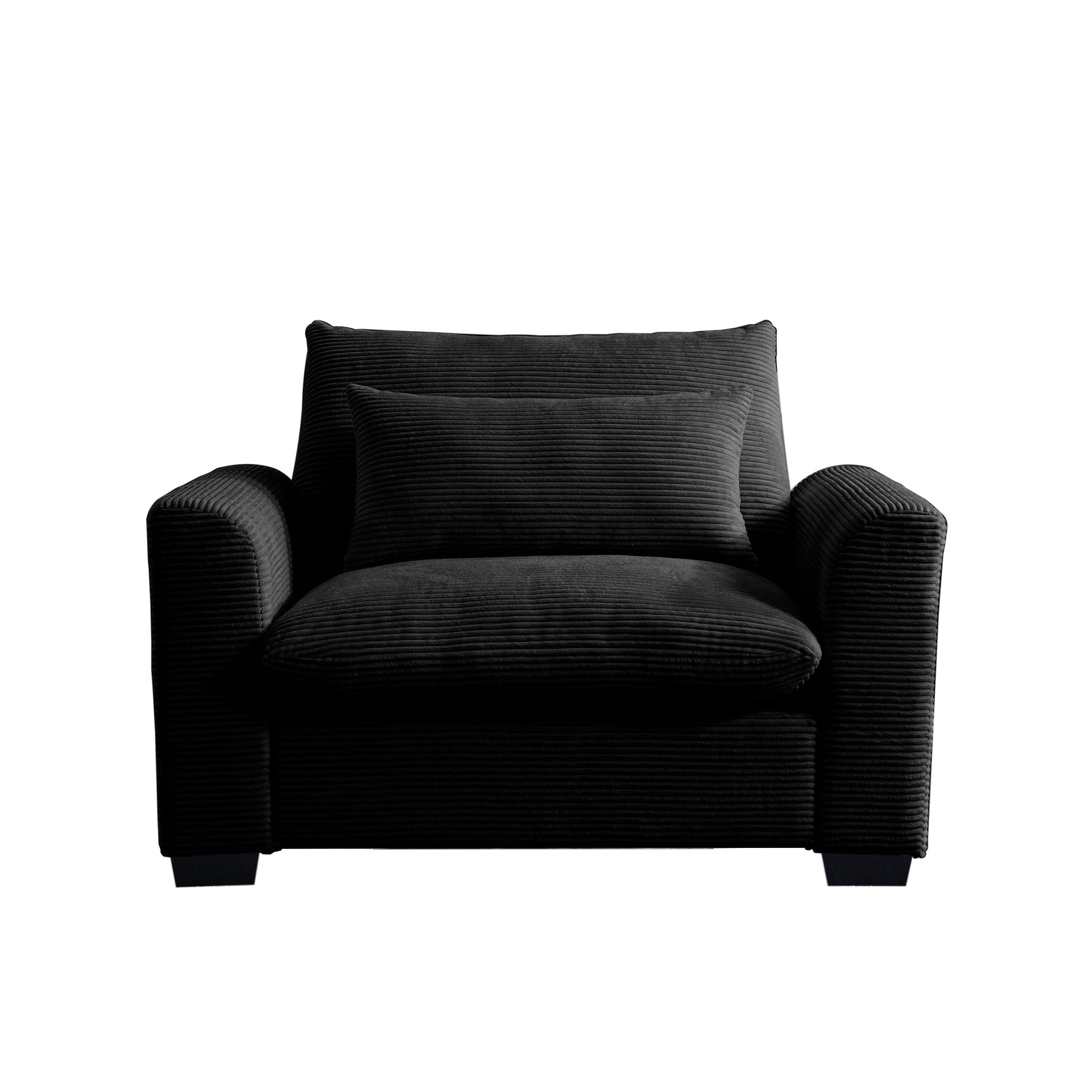 Black corduroy armchair with textured upholstery and a matching lumbar pillow for comfort