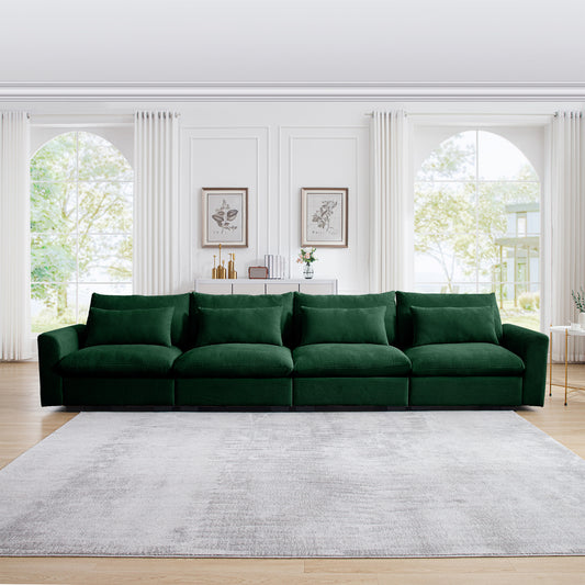 Emerald green corduroy sectional sofa with plush throw pillows