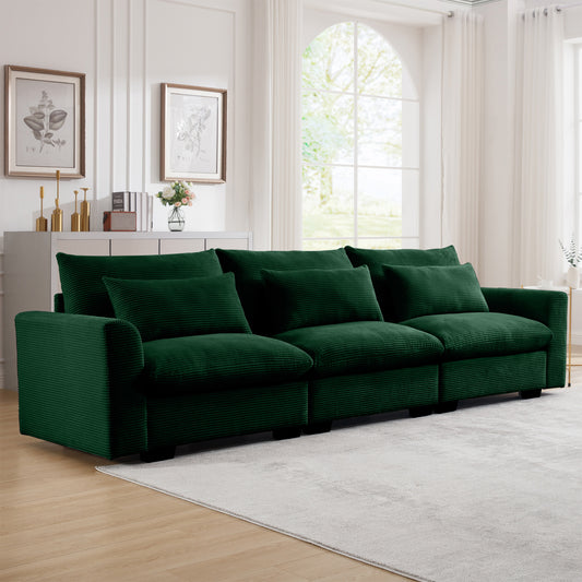 Plush forest green corduroy sofa with deep seats and lumbar pillows ideal for living rooms
