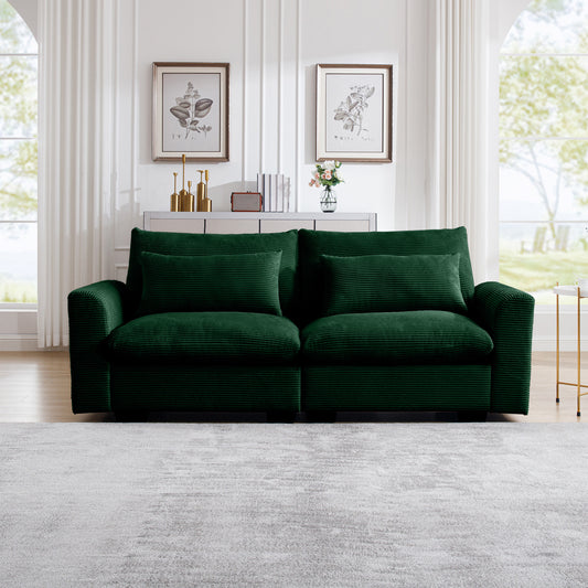 Deep green corduroy sofa with plush cushions perfect for a modern living room