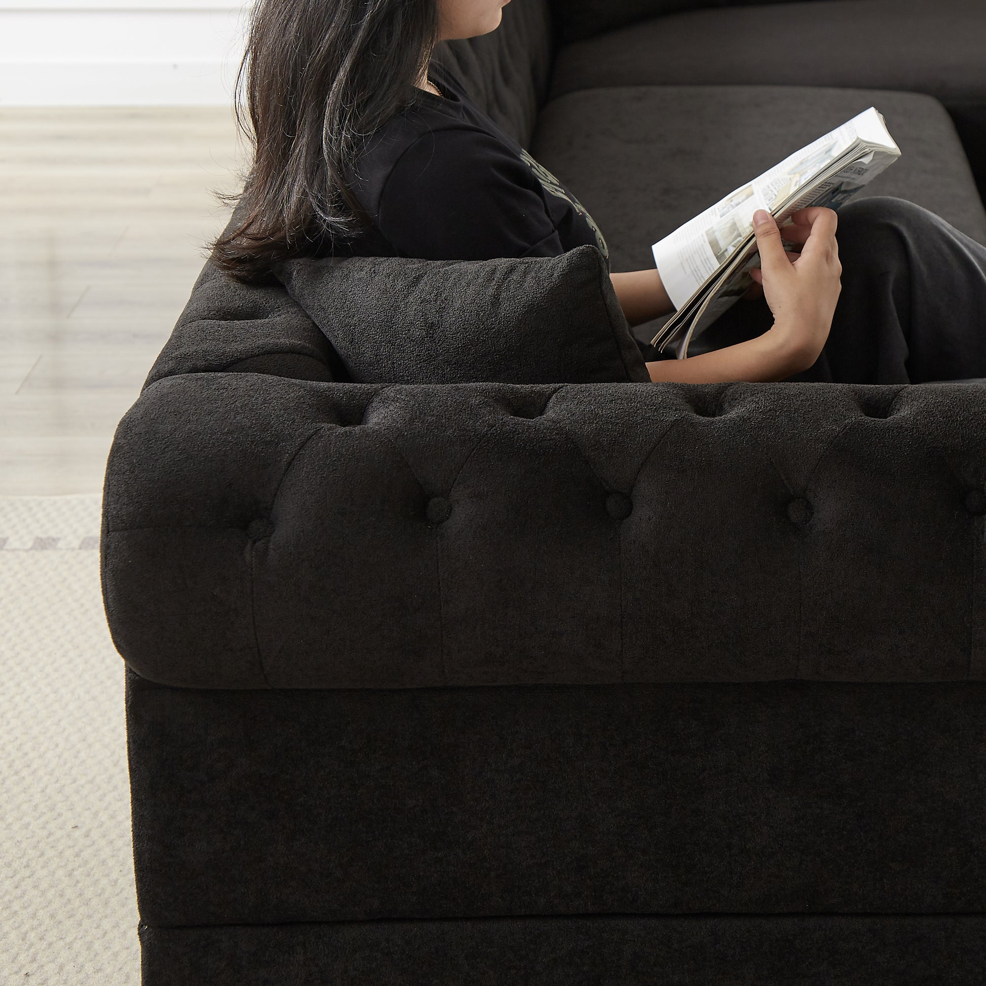 Dark grey textured fabric sectional sofa with tufted details for a luxurious living room