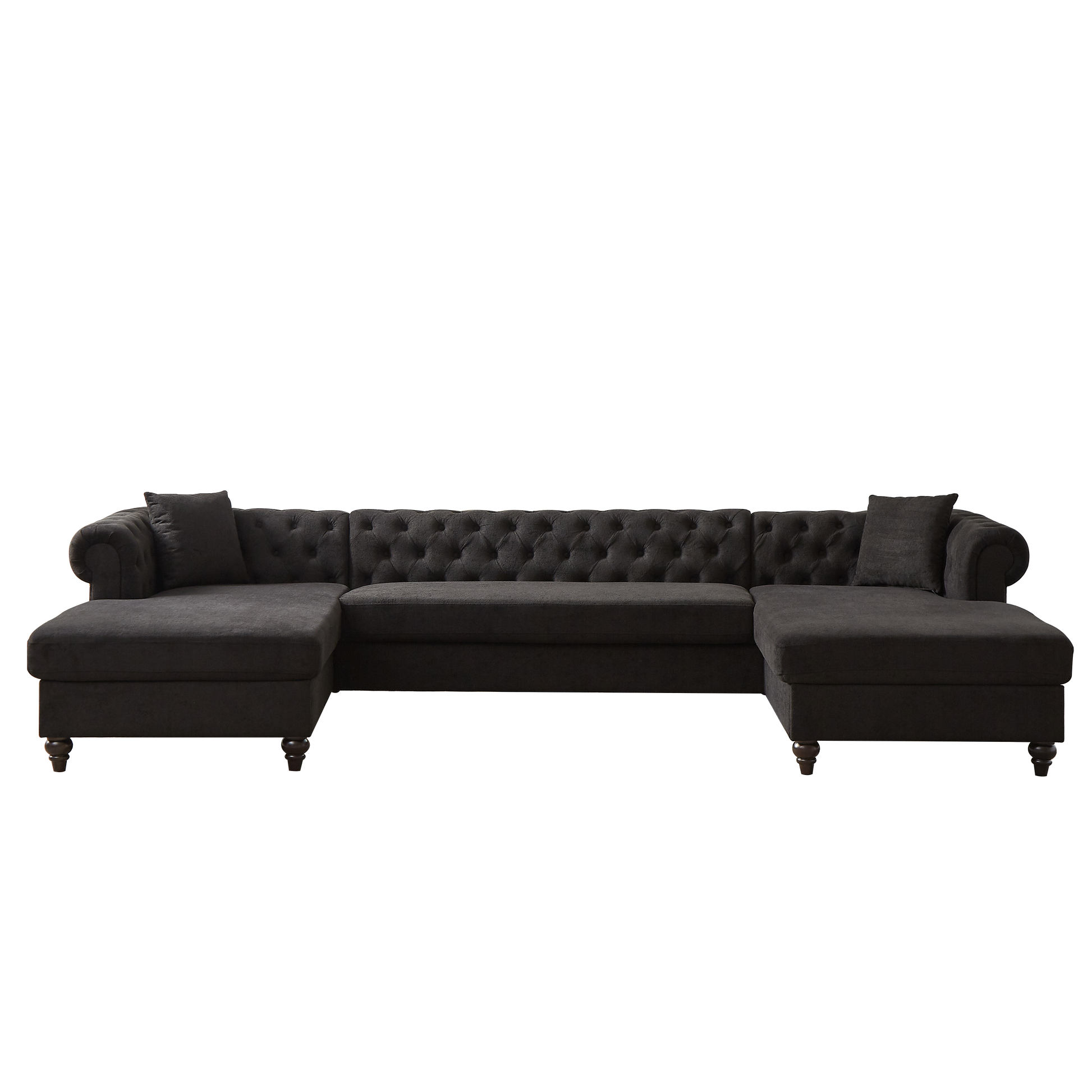Dark charcoal grey tufted sectional sofa with chaise lounges and rolled arms perfect for a modern living room