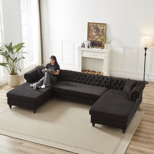Dark charcoal fabric Chesterfield sectional sofa with tufted cushions and plush seats for a spacious living room