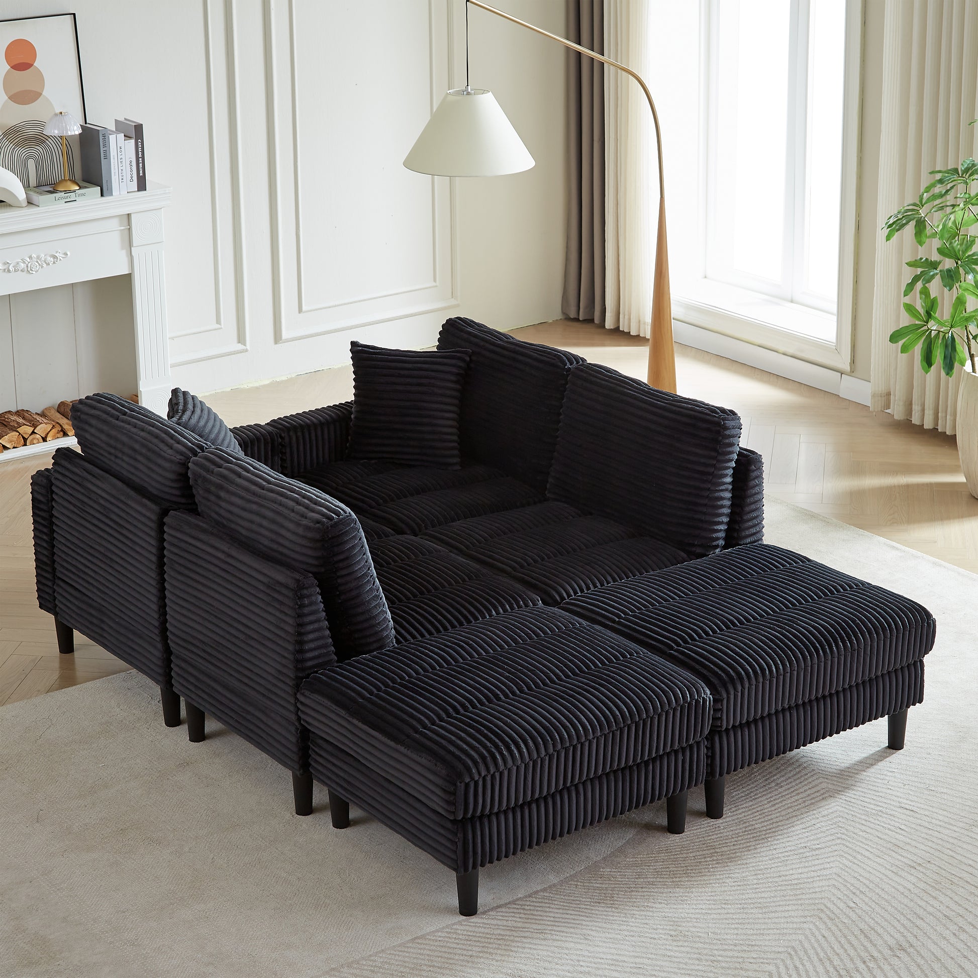 Black corduroy sectional sofa with multiple ottomans for versatile living room arrangements