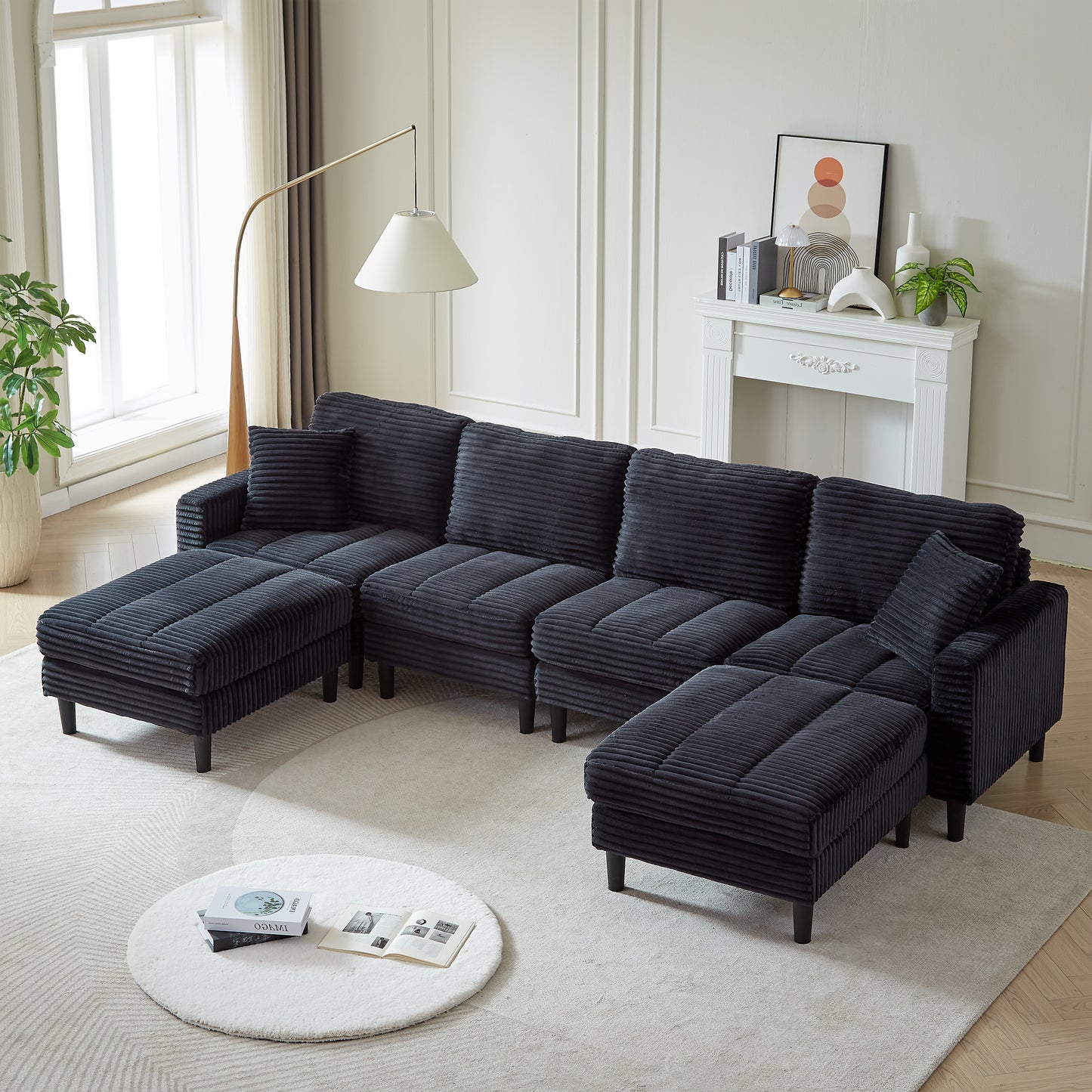 Dark gray corduroy sectional sofa with reversible chaise and ottoman perfect for modern living rooms