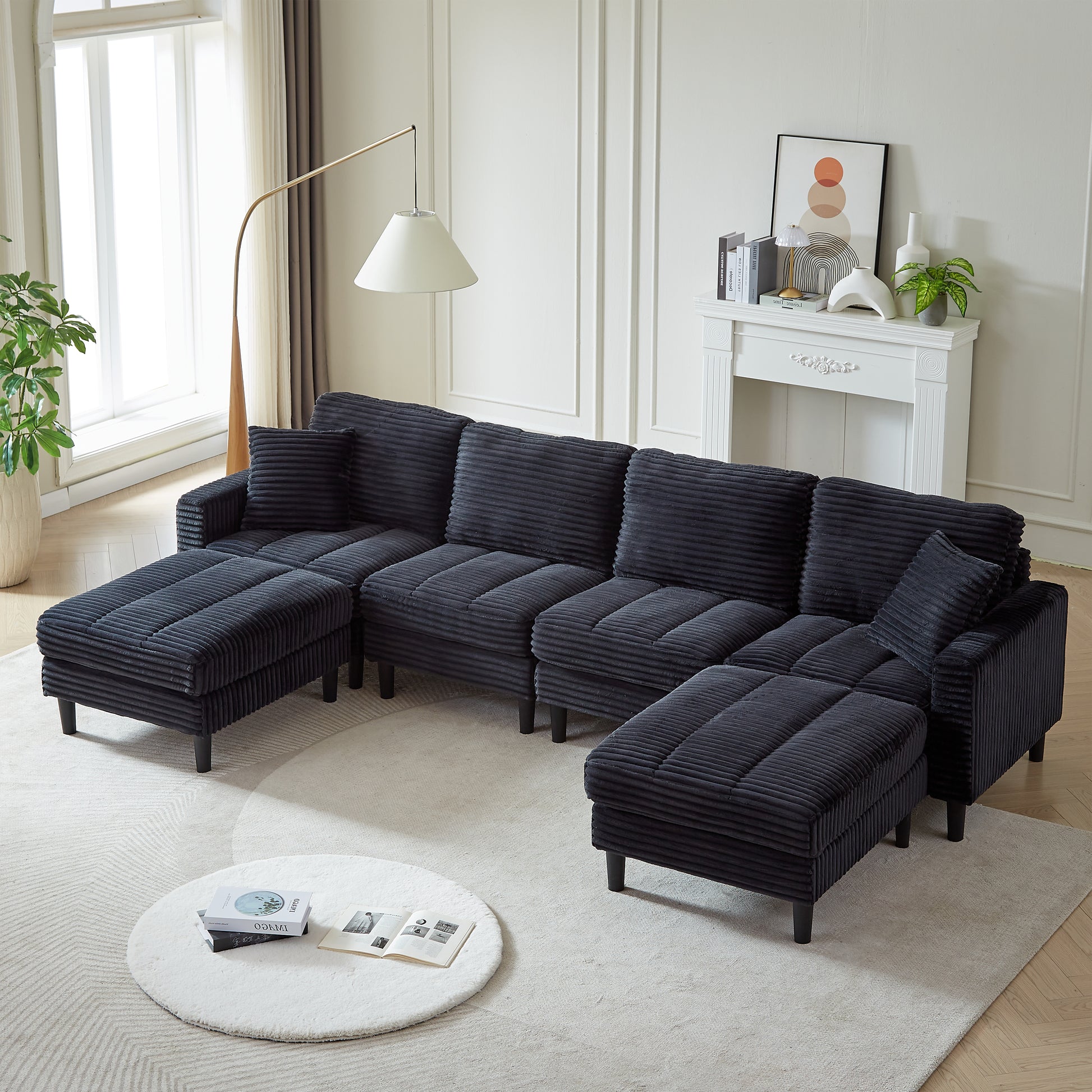 Dark gray corduroy sectional sofa with reversible chaise and ottoman perfect for modern living rooms