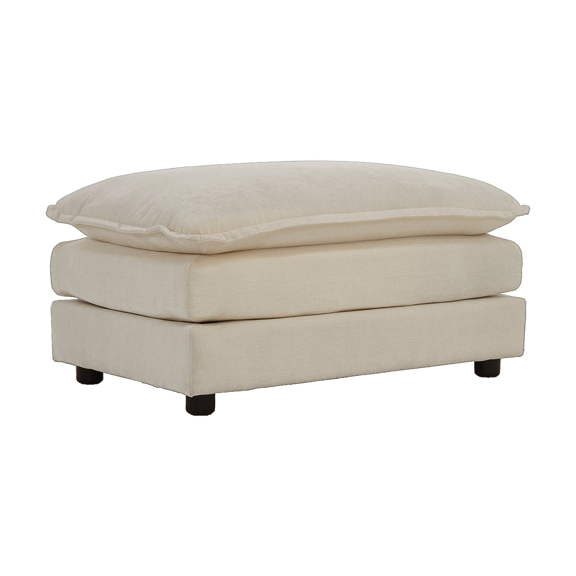Cream upholstered ottoman with a layered pillow top and dark wooden legs