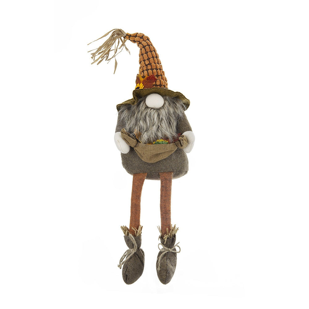Fall gnome decoration with textured orange hat and grey beard holding a sack of colorful leaves