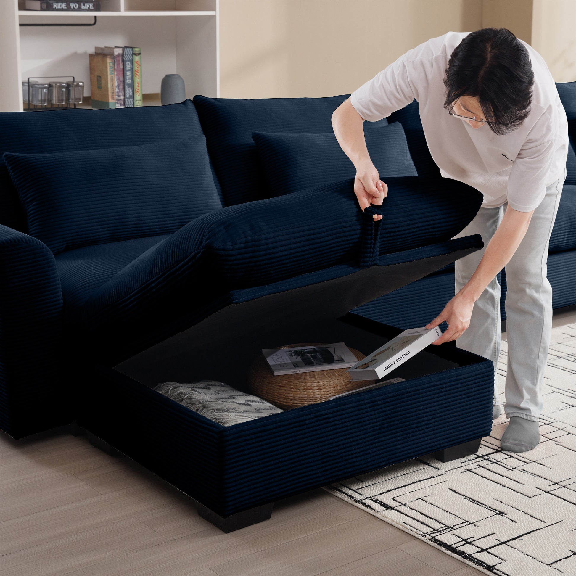 Dark navy corduroy sectional sofa with hidden storage compartment open