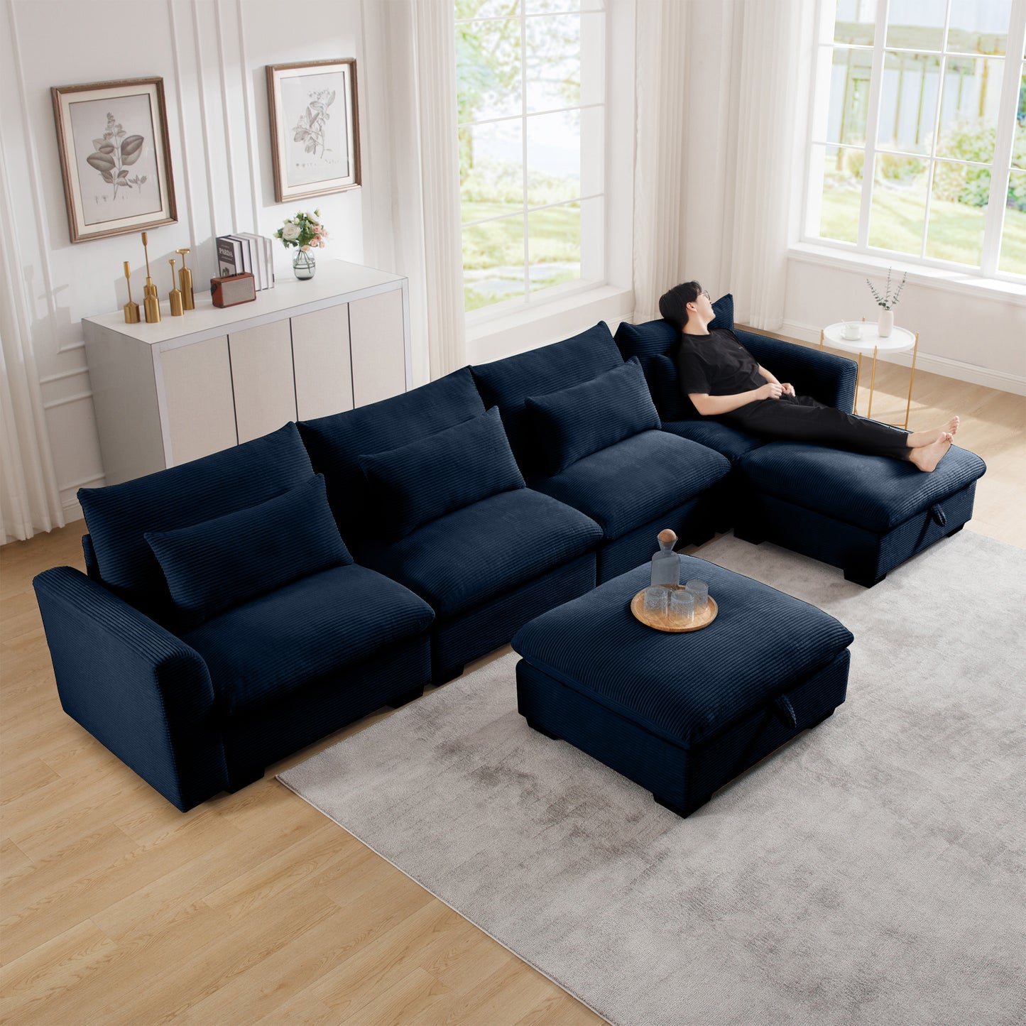 Deep navy corduroy sectional sofa with plush cushions and ottoman perfect for modern living rooms