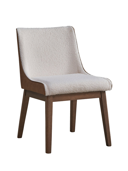 Cream boucle dining chair with brown faux leather accents and dark wood legs