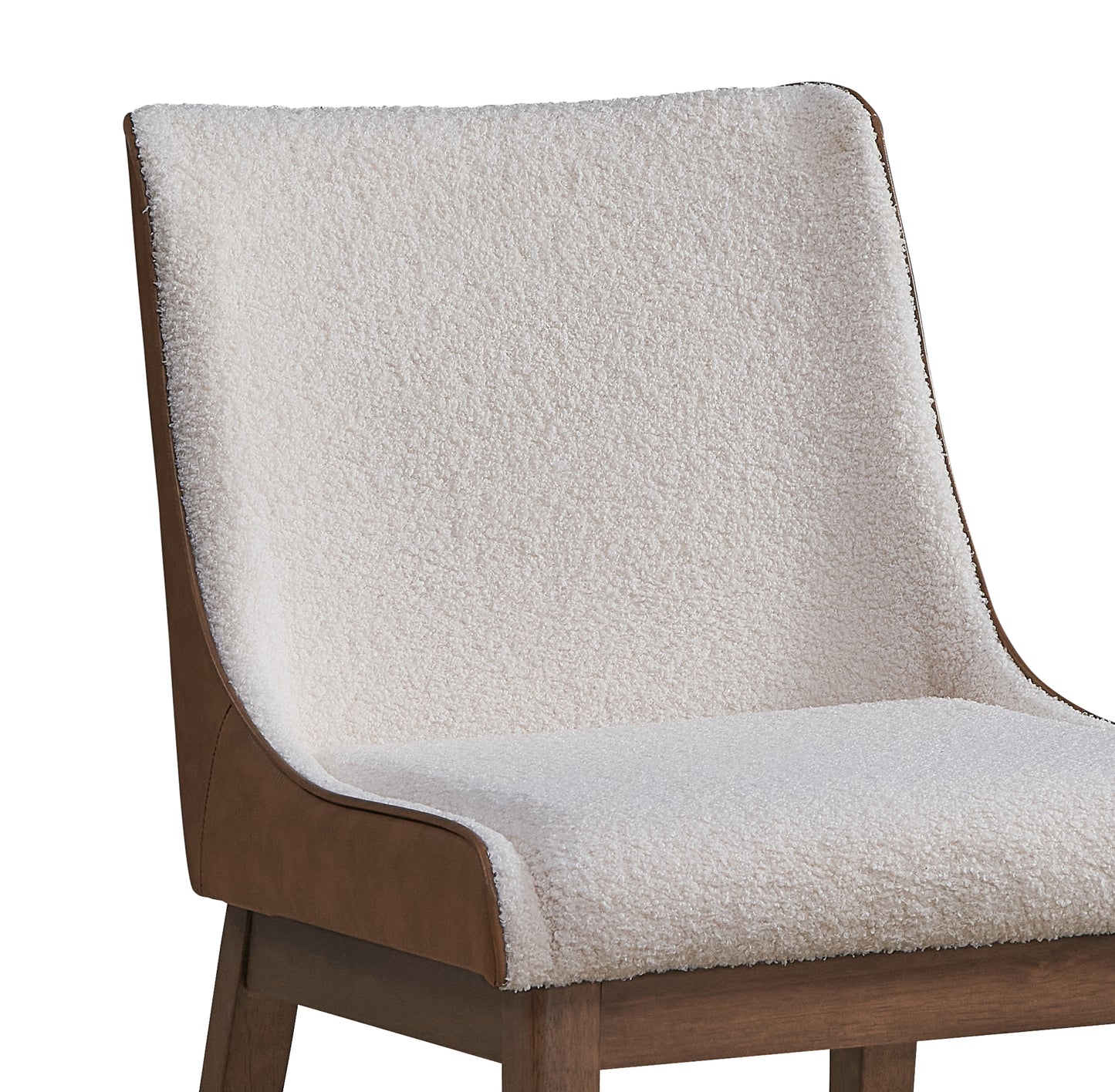 Cream boucle dining chair with rich brown faux leather accents and wooden legs