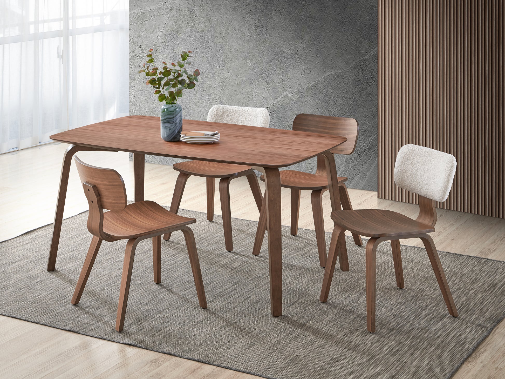 Walnut dining table with four curved wooden chairs two with fluffy white cushions