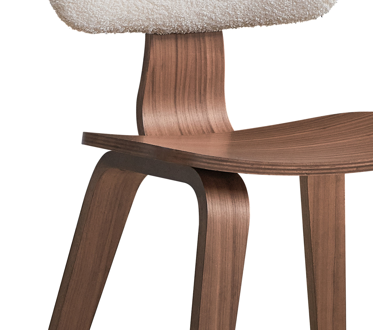 Curved walnut veneer chair with textured boucle seat perfect for modern dining rooms