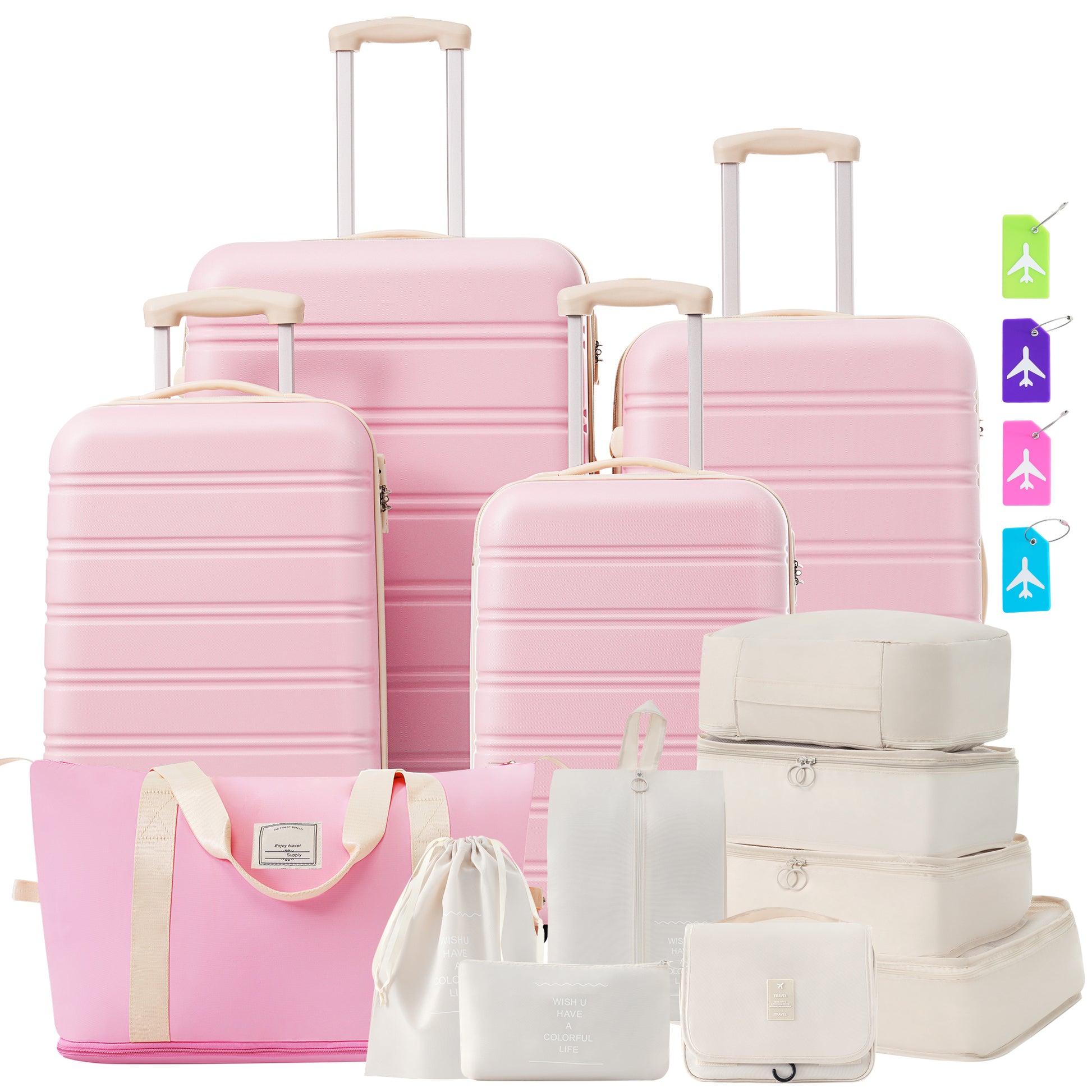 Pink hardside luggage set with cream accents and assorted travel organizers